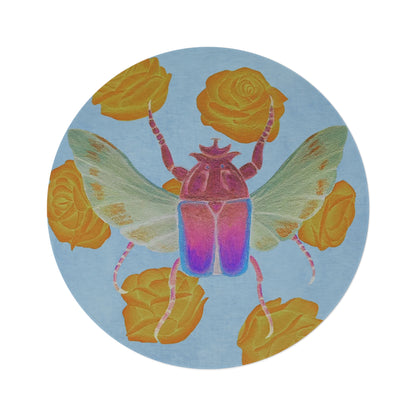 Round area rug close-up of colorful scarab beetle with yellow rose petals
