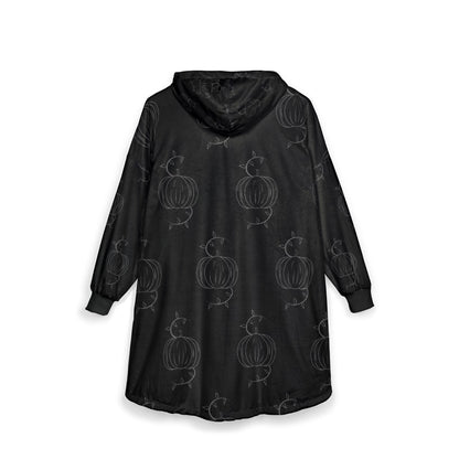 Black hooded blanket with allover pumpkin motif, rear view