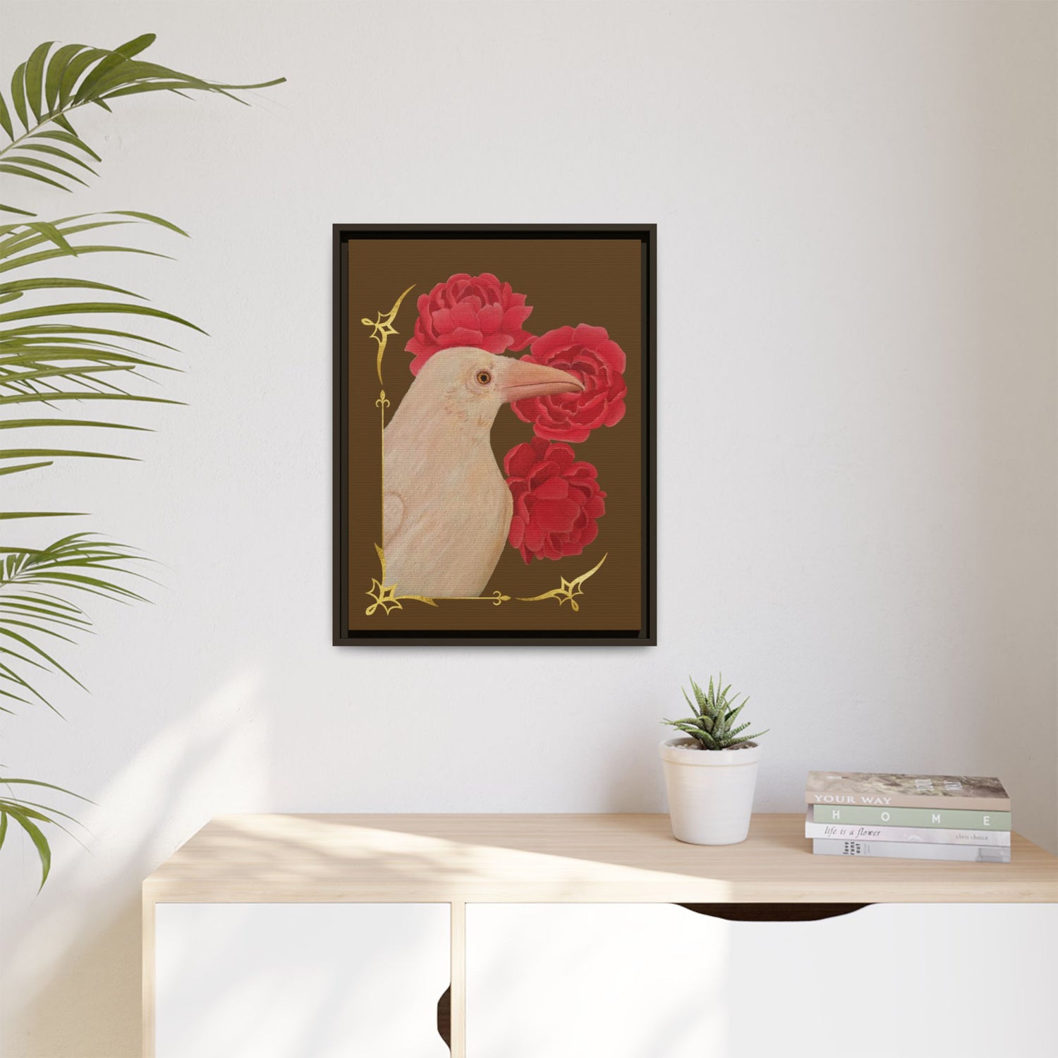 Small black framed canvas art print featuring a white raven and red peonies.