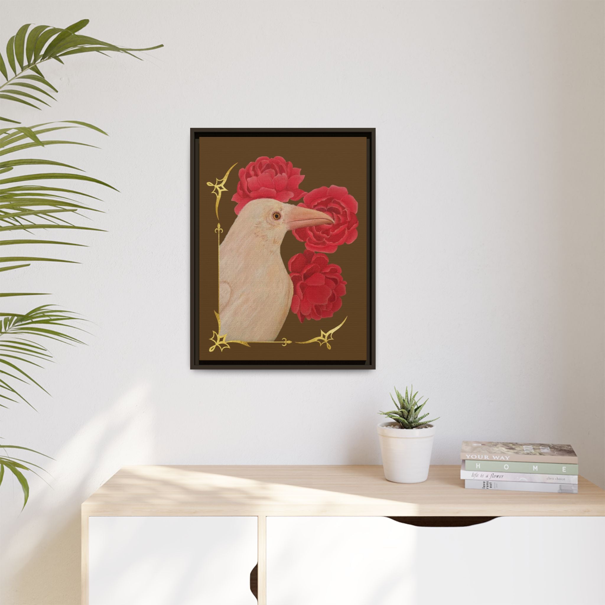 Small black framed canvas art print featuring a white raven and red peonies.