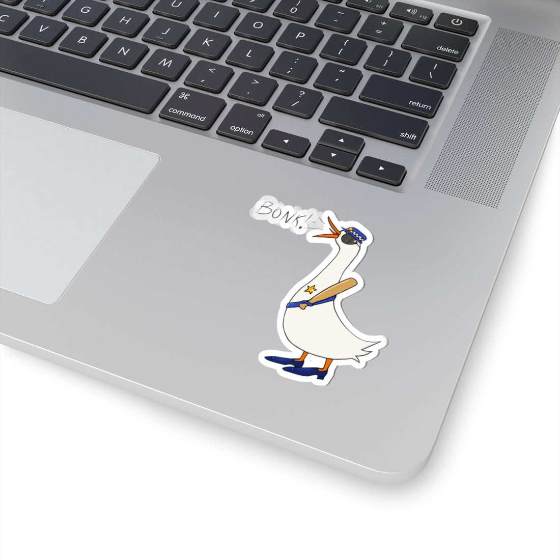 Kiss-cut sticker showing cartoon goose in blue uniform with “BONK!” text on a laptop