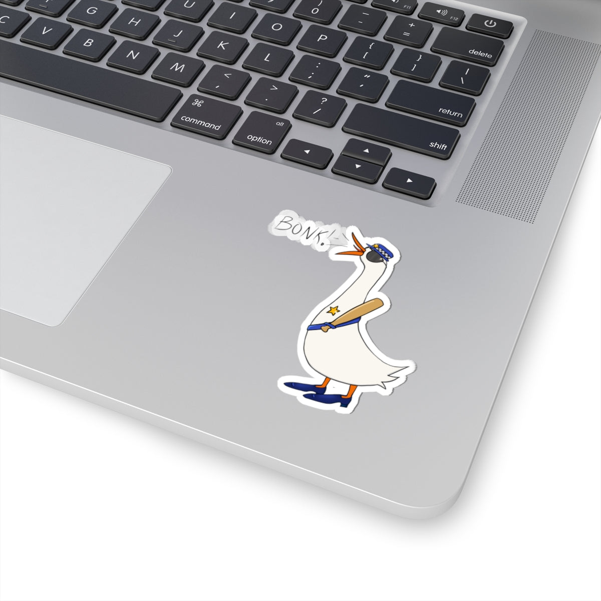 Kiss-cut sticker showing cartoon goose in blue uniform with “BONK!” text on a laptop