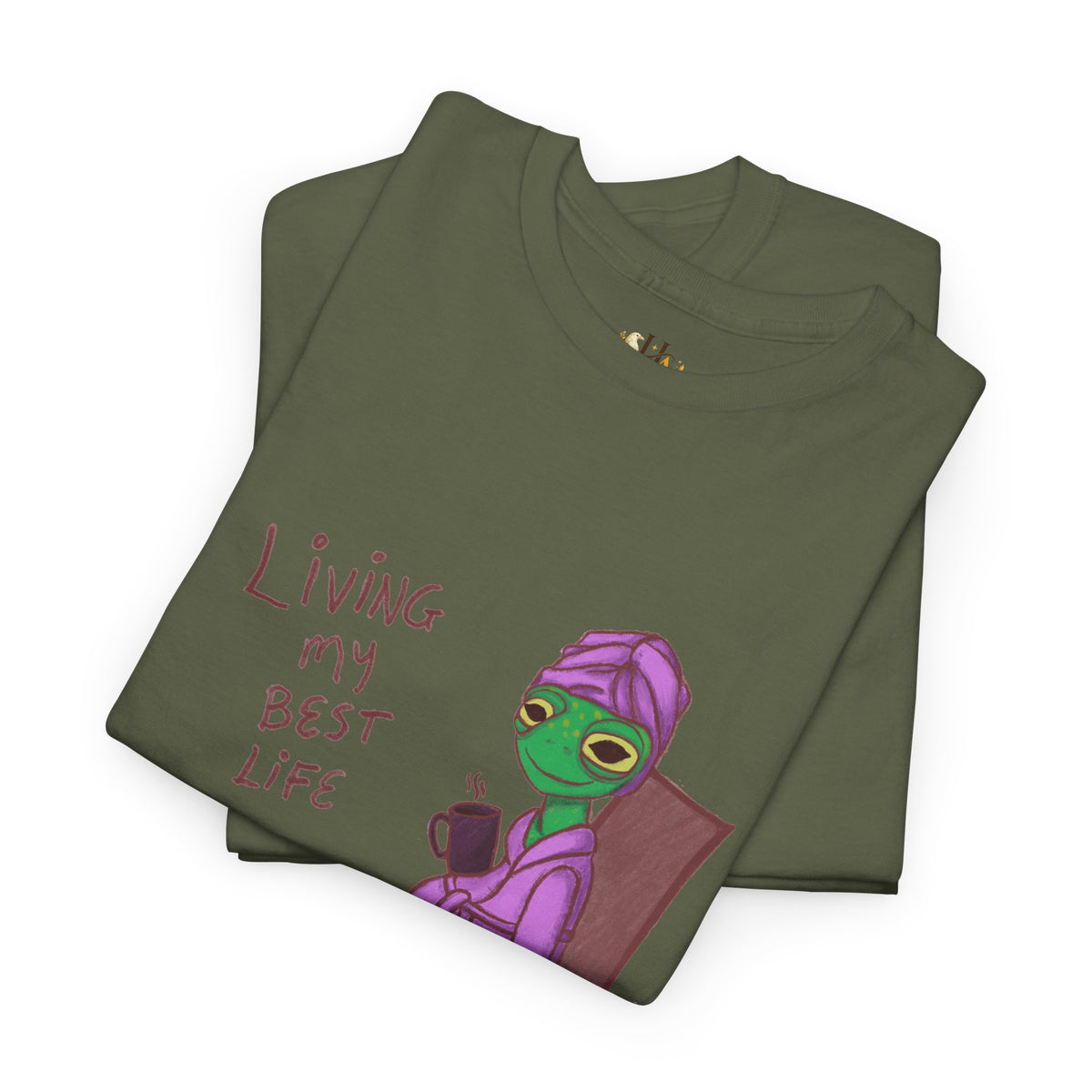 Dark green graphic t-shirt with purple character holding a cup and “Living my Best Life”