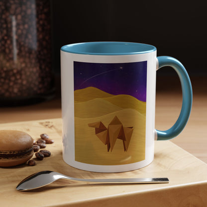 Coffee mug with blue handle and rim, white body, origami camel desert night sky scene