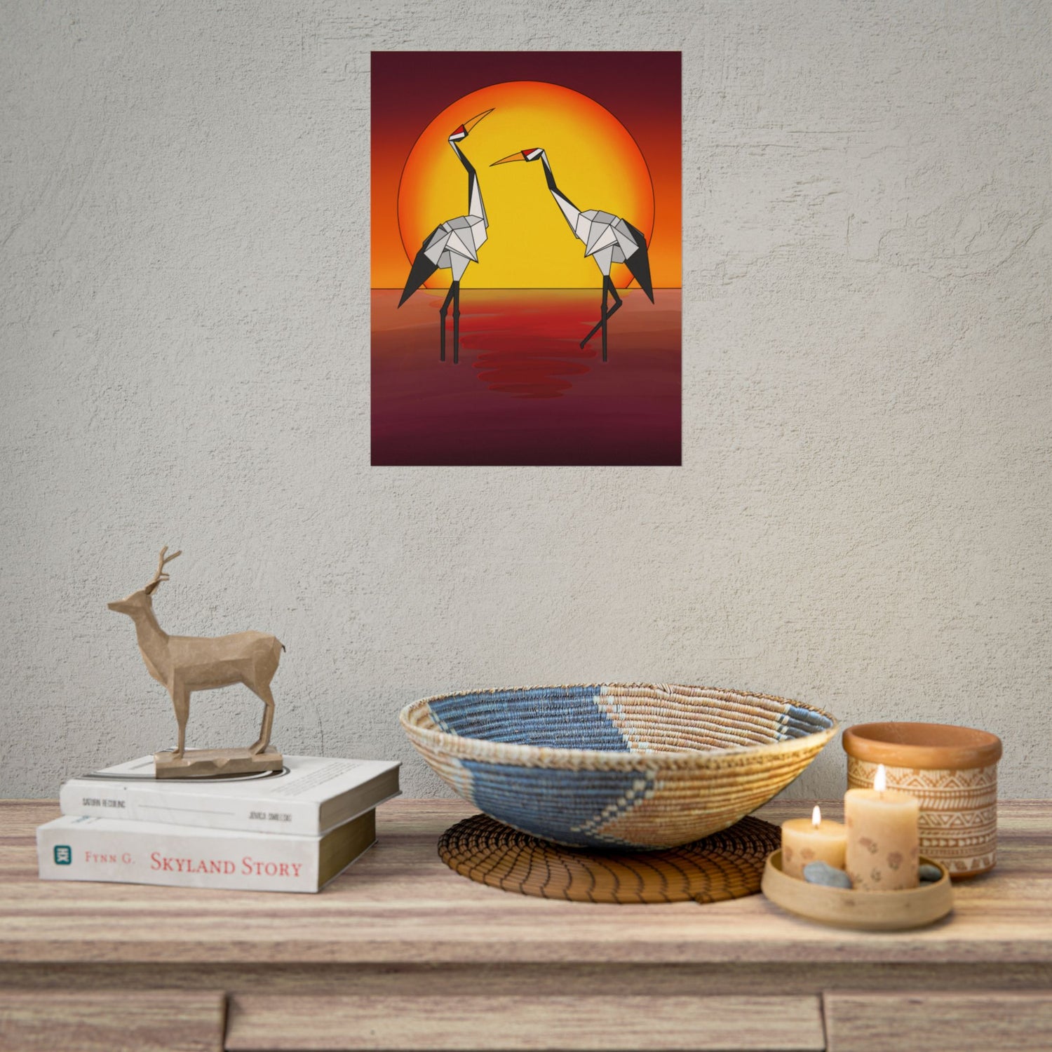 Square sunset poster with two yellow-and-gray origami cranes in front of a glowing circle