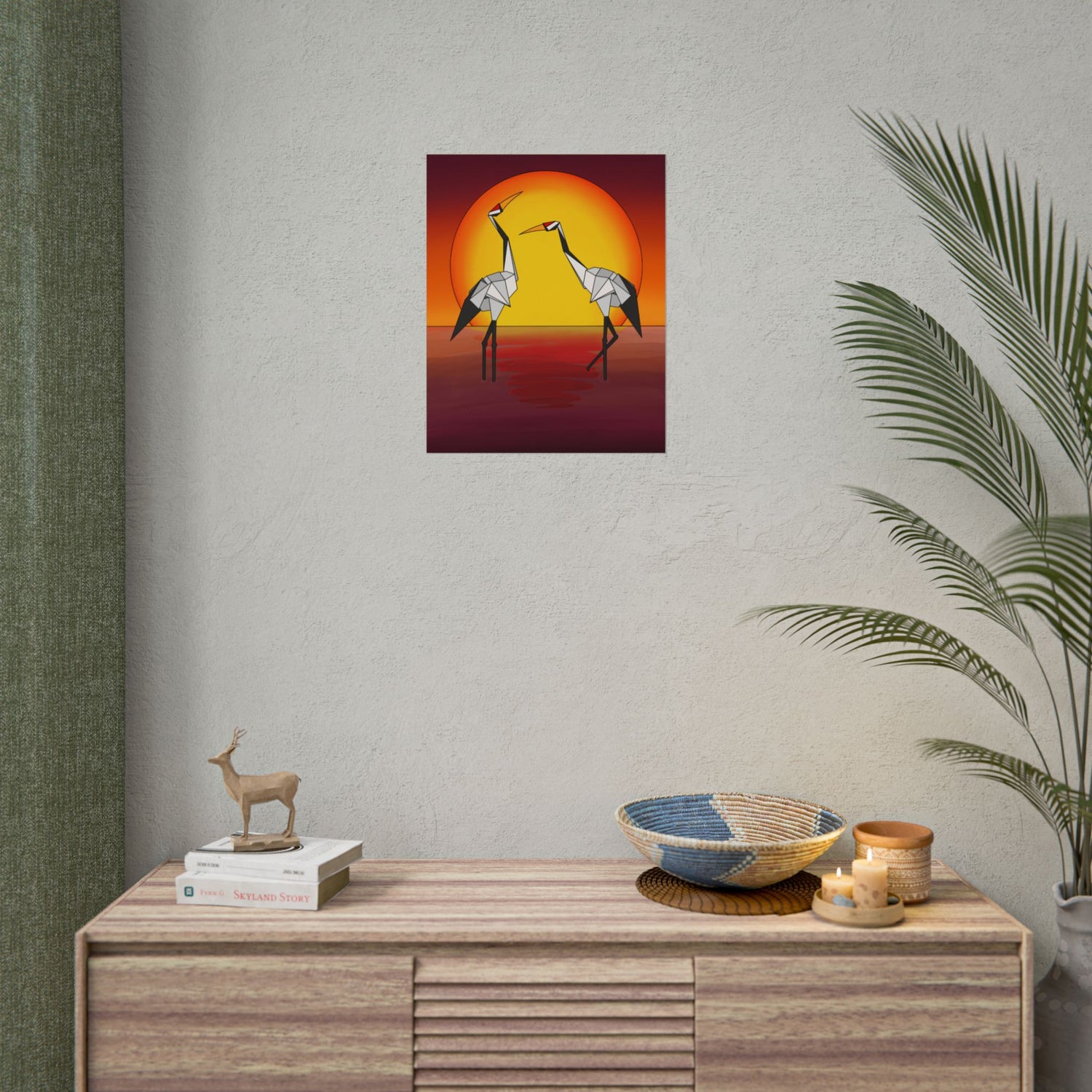 Sunset origami crane poster centered above a console table with two yellow birds