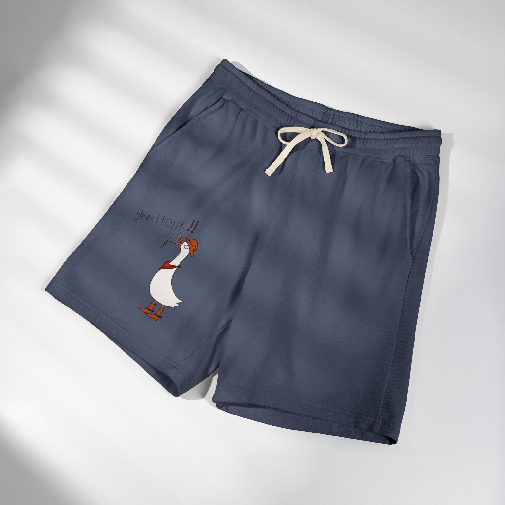 Navy sweat shorts with cream drawstring and cartoon duck graphic on left leg