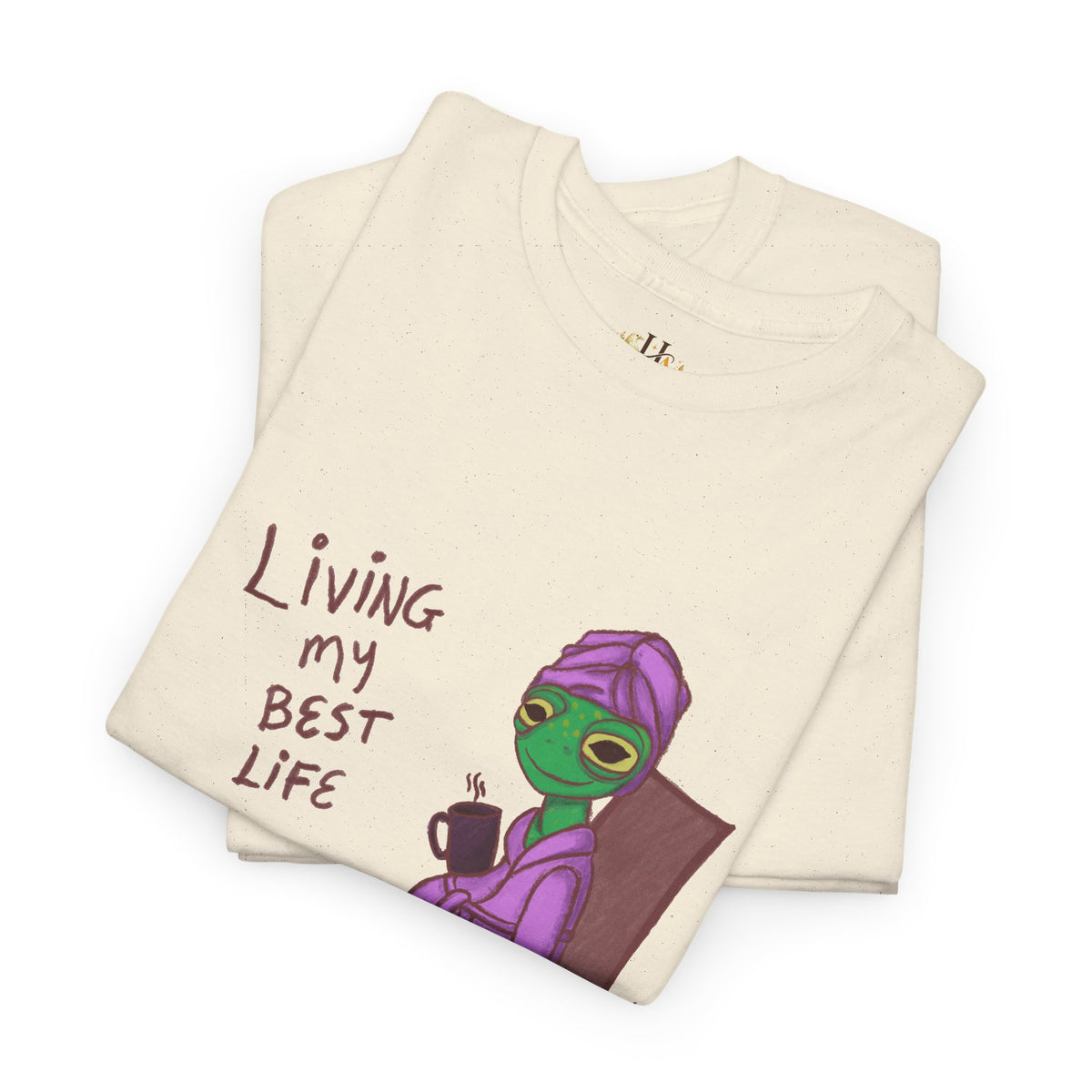 Cream graphic t-shirt with “Living my Best Life” text and character illustration