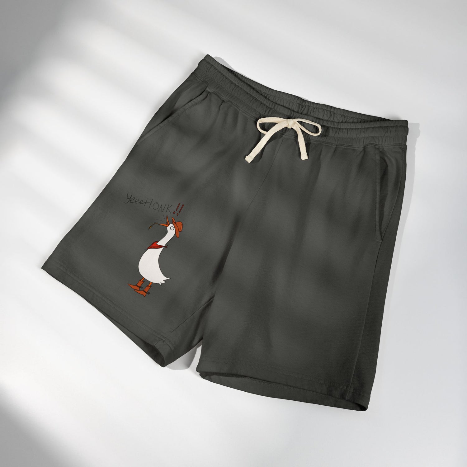 Dark gray graphic sweat shorts, folded, with drawstring and cartoon goose print