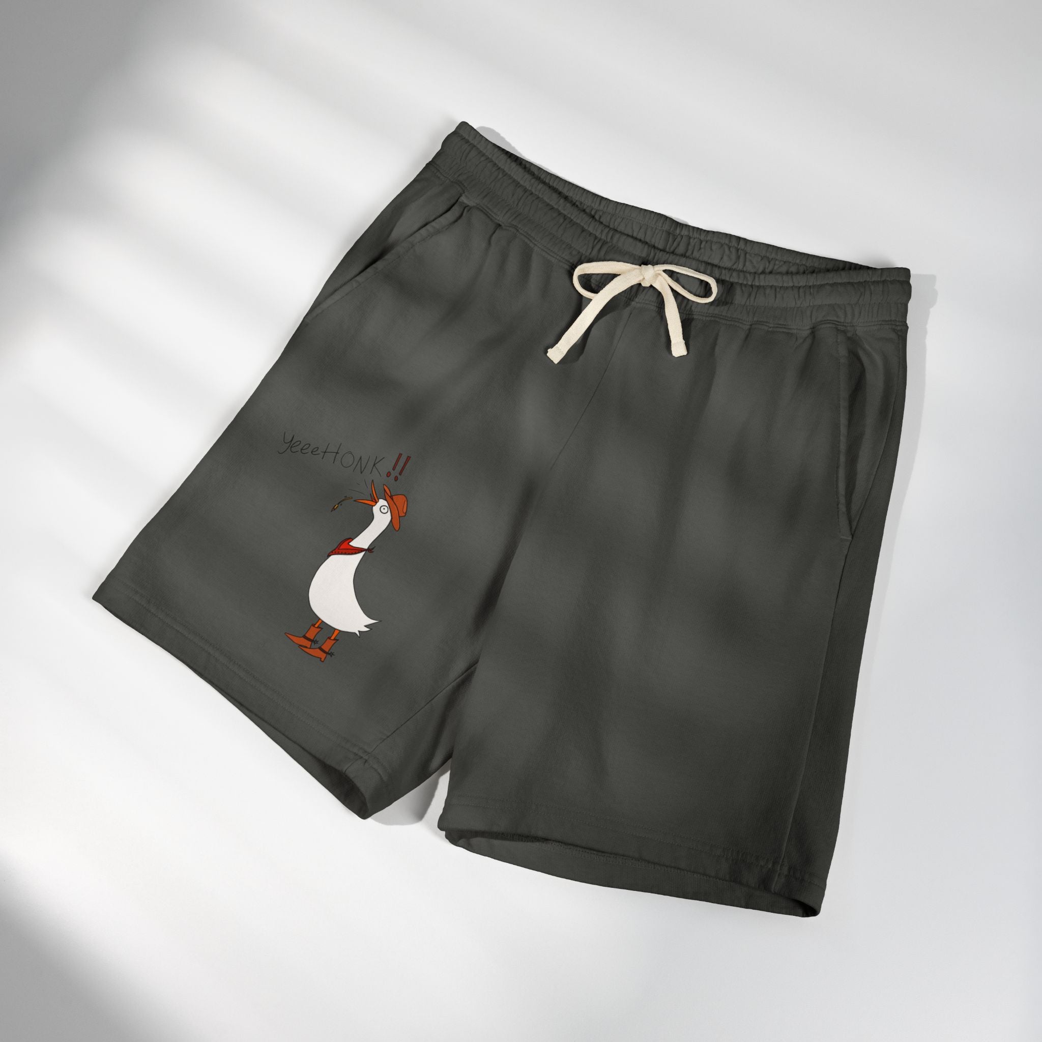 Dark gray graphic sweat shorts, folded, with drawstring and cartoon goose print
